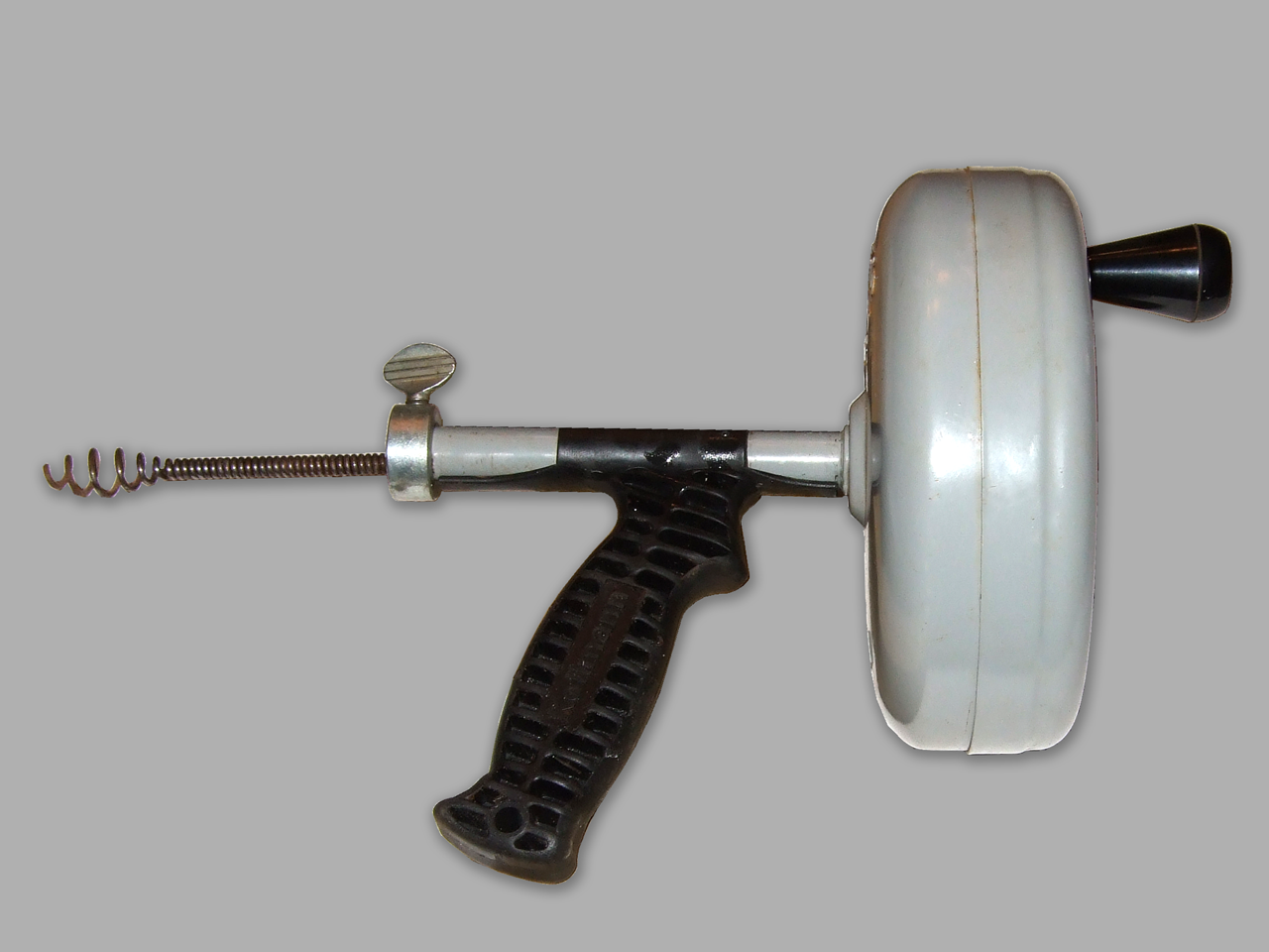 Image of plumbers handheld drain auger